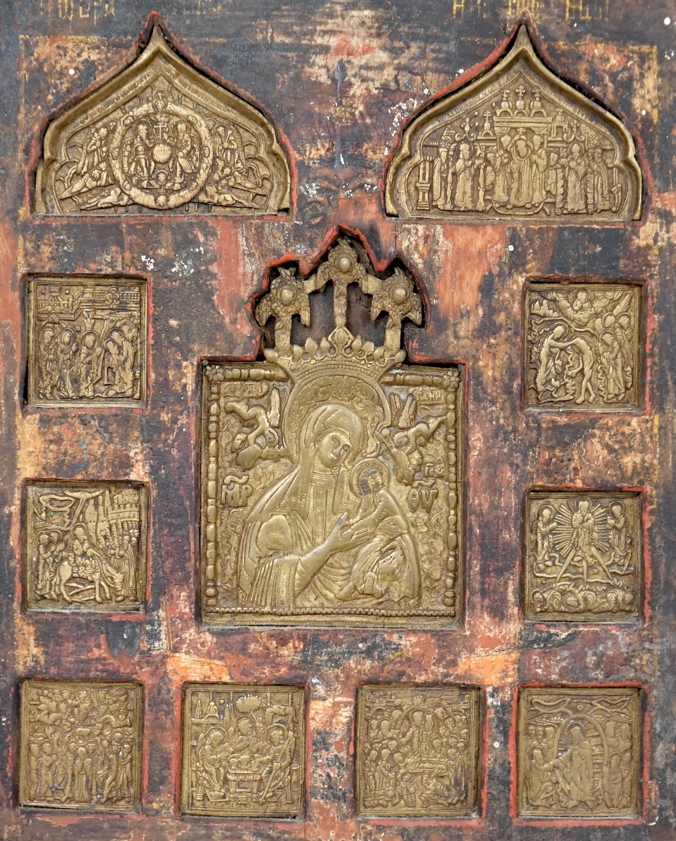 19th century Russian school, Icon with inset brass panels, The Virgin Mary and Child, incised inscription and stamp verso, 31 x 26cm